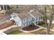 An elevated view showcases this two-story home, green lawn, and fenced yard with mature trees at 5412 Farley Dr, Raleigh, NC 27609