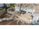 Outdoor back deck with dining and lounge furniture, wood and stone patio, and fenced yard at 5412 Farley Dr, Raleigh, NC 27609