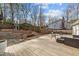 Large back deck with outdoor furniture, patio, play house and fenced in yard at 5412 Farley Dr, Raleigh, NC 27609