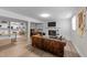 Inviting basement area with a fireplace, shelving, and comfortable seating with a large leather couch at 5412 Farley Dr, Raleigh, NC 27609
