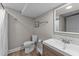 Modern bathroom with a shower, vanity with a sink, and commode with neutral paint and new flooring at 5412 Farley Dr, Raleigh, NC 27609