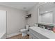 Contemporary bathroom with a modern vanity, toilet, and tub with a shower and neutral paint at 5412 Farley Dr, Raleigh, NC 27609