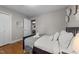 Charming bedroom has hardwood floors, a comfy bed, and a view to another bedroom at 5412 Farley Dr, Raleigh, NC 27609