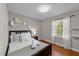 Inviting bedroom with hardwood floors, cozy bedding, and a sunny window at 5412 Farley Dr, Raleigh, NC 27609
