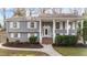 Inviting home featuring a classic design with white trim, brick accents, and a welcoming entrance at 5412 Farley Dr, Raleigh, NC 27609