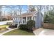 Traditional two-story home with mature landscaping, a columned porch, and a well-maintained lawn at 5412 Farley Dr, Raleigh, NC 27609