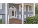 Charming front entry with brick steps, classic door and hardware at 5412 Farley Dr, Raleigh, NC 27609