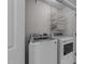 Convenient laundry room with modern appliances, shelving, and ample storage space at 5412 Farley Dr, Raleigh, NC 27609