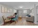 Comfortable living area and dining area with neutral colors and modern flooring in the basement at 5412 Farley Dr, Raleigh, NC 27609