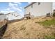 View of the home's backyard featuring a wooden deck and fenced yard on a sunny day at 5439 Ripplebrook Rd, Durham, NC 27712