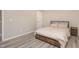 This bedroom is a serene space with vinyl plank flooring and a cozy bed at 5439 Ripplebrook Rd, Durham, NC 27712