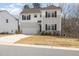 Charming two-story home featuring a two-car garage, stone accents, and a well-manicured lawn at 5439 Ripplebrook Rd, Durham, NC 27712