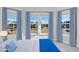 Bedroom with three large windows, curtains, and view of a charming neighborhood at 5501 Advancing Ave, Raleigh, NC 27616