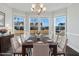 Bright dining room with bay windows, a modern chandelier, and stylish furnishings at 5501 Advancing Ave, Raleigh, NC 27616