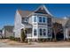 Charming gray two-story home with white trim, landscaped yard, and a welcoming entrance at 5501 Advancing Ave, Raleigh, NC 27616