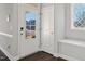 Bright foyer with a glass-paneled door and side bench, offers a warm welcome at 5501 Advancing Ave, Raleigh, NC 27616