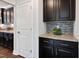A partial view of the kitchen with granite countertops and dark wood cabinets at 5501 Advancing Ave, Raleigh, NC 27616