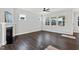 Spacious living room showcases fireplace, hardwood floors, and multiple windows at 5501 Advancing Ave, Raleigh, NC 27616