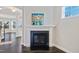 Bright living room with dark wood floors and a fireplace at 5501 Advancing Ave, Raleigh, NC 27616