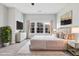 Serene main bedroom with large windows, stylish decor, and luxurious bedding at 5501 Advancing Ave, Raleigh, NC 27616
