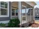 Screened porch with white railings and view of neighborhood at 5501 Advancing Ave, Raleigh, NC 27616