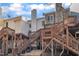 View of the back exterior featuring multiple decks and staircases at 6036 Epping Forest Dr, Raleigh, NC 27613