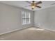 Bedroom with a ceiling fan and a light-filled window at 6036 Epping Forest Dr, Raleigh, NC 27613