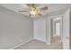 Bright bedroom with a ceiling fan, a large closet, and an entrance to another room at 6036 Epping Forest Dr, Raleigh, NC 27613