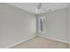 A simple bedroom featuring a window for natural light and neutral-colored walls at 6036 Epping Forest Dr, Raleigh, NC 27613