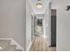Bright entryway features wood flooring and neutral paint, leading into the home's living spaces at 6036 Epping Forest Dr, Raleigh, NC 27613