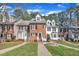 Charming row of townhouses with a well manicured lawn and beautiful landscaping at 6036 Epping Forest Dr, Raleigh, NC 27613