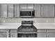 Kitchen features stainless steel appliances and bright countertops at 6036 Epping Forest Dr, Raleigh, NC 27613