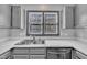 Updated kitchen features stainless sink and appliances, and bright countertops at 6036 Epping Forest Dr, Raleigh, NC 27613