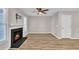 Bright living room featuring fireplace, and wood flooring at 6036 Epping Forest Dr, Raleigh, NC 27613