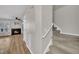 Hallway with carpeted staircase to the upper level at 6036 Epping Forest Dr, Raleigh, NC 27613