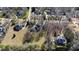 Neighborhood aerial showcasing landscaped lots, mature trees, and elegant homes in a residential area at 6532 Wakefalls Dr, Wake Forest, NC 27587