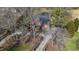 Aerial view showcases the home, its driveway, mature trees, and surrounding landscaped grounds at 6532 Wakefalls Dr, Wake Forest, NC 27587
