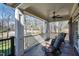 Charming balcony with ceiling fan, stone flooring, and white railing offering beautiful views of the property at 6532 Wakefalls Dr, Wake Forest, NC 27587