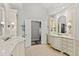 Well-lit bathroom features double vanity sinks and ample storage space at 6532 Wakefalls Dr, Wake Forest, NC 27587