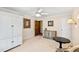 This bedroom features neutral walls, carpeted floor, white armoire and cabinets, along with dark wood accents at 6532 Wakefalls Dr, Wake Forest, NC 27587