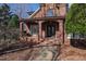 Elegant brick entryway with arched porch featuring detailed iron double doors and stone walkway at 6532 Wakefalls Dr, Wake Forest, NC 27587
