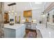 A well appointed kitchen with marble island, stainless steel appliances, and custom wood cabinets at 6532 Wakefalls Dr, Wake Forest, NC 27587