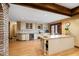 Bright kitchen with stainless steel appliances and views into the dining room at 6532 Wakefalls Dr, Wake Forest, NC 27587