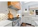 This kitchen features a large oven range and backsplash at 6532 Wakefalls Dr, Wake Forest, NC 27587