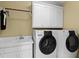 Well-equipped laundry room featuring a modern washer and dryer and ample cabinet space at 6532 Wakefalls Dr, Wake Forest, NC 27587