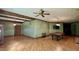 Large living room boasts a beamed ceiling, hardwood floors, and a pool table for added entertainment at 6532 Wakefalls Dr, Wake Forest, NC 27587