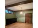 Living room boasts wood floors, wood beams, green walls, and wooden door at 6532 Wakefalls Dr, Wake Forest, NC 27587