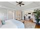 Spacious main bedroom features a decorative armoire and access to the ensuite sitting room at 6532 Wakefalls Dr, Wake Forest, NC 27587