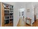 Walk-in pantry with custom shelving for optimal organization, located off a bright hallway at 6532 Wakefalls Dr, Wake Forest, NC 27587