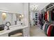 Spacious walk-in closet boasts custom shelving and a vanity area at 6532 Wakefalls Dr, Wake Forest, NC 27587